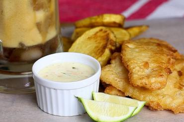Enjoy a pair of fried fish soaked in beer and potatoes.